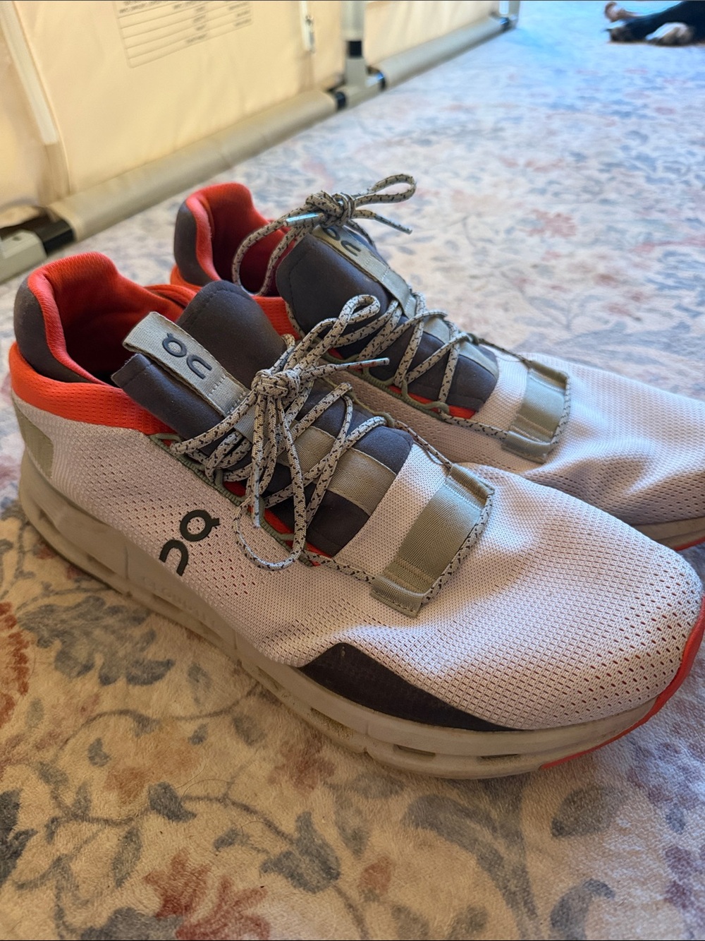 On Running Men’s Athletic Sneakers in White with Orange and Gray Accents